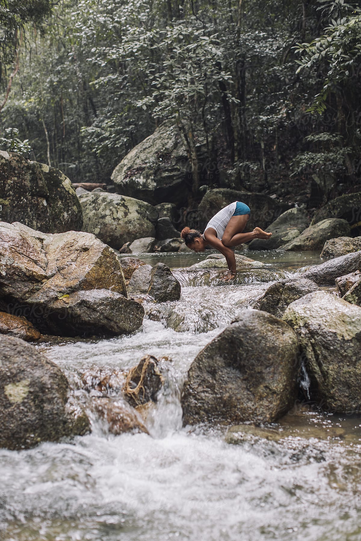 Woman Doing Yoga in the Stream