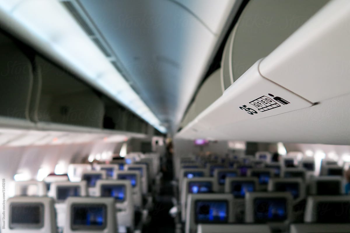 Airplane interior with open luggage shelves
