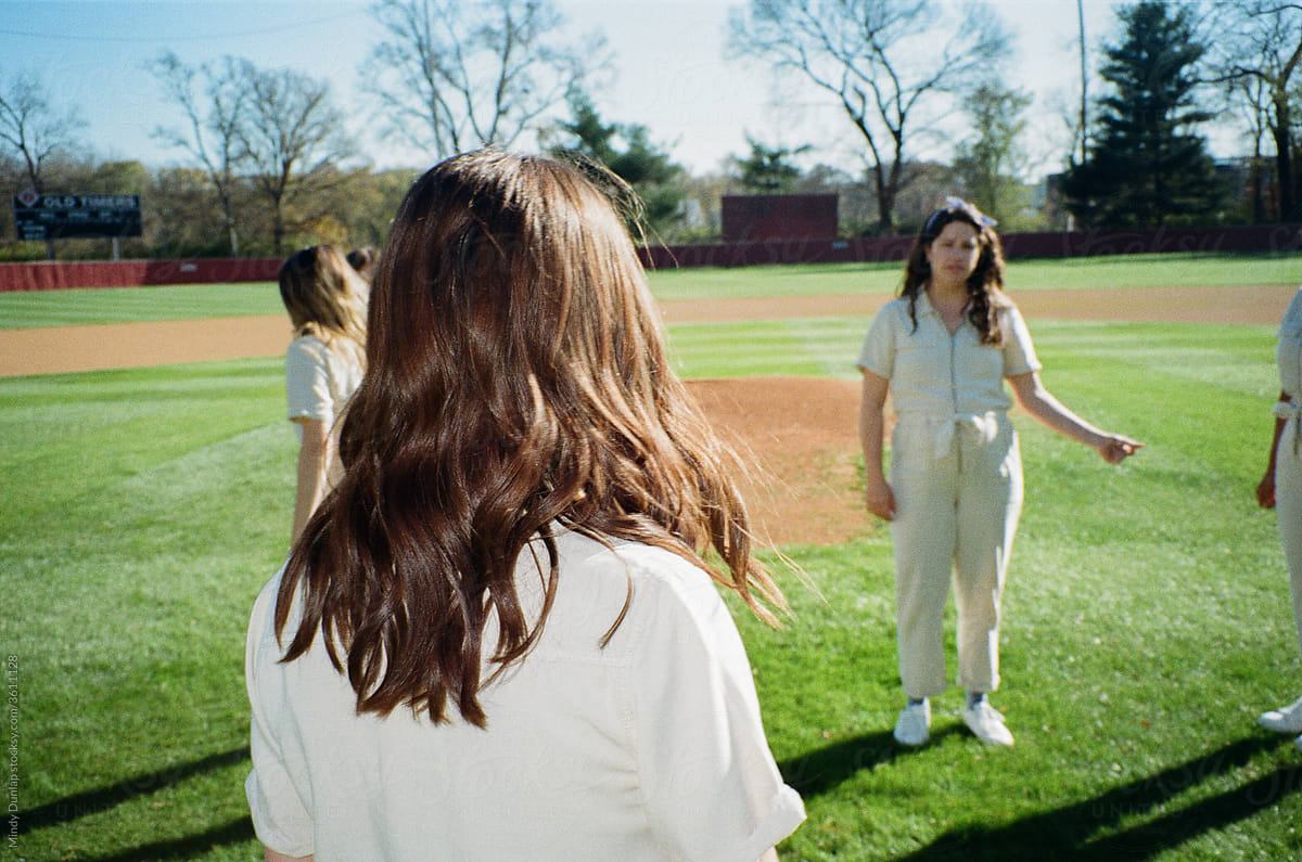 Young woman on a baseball field