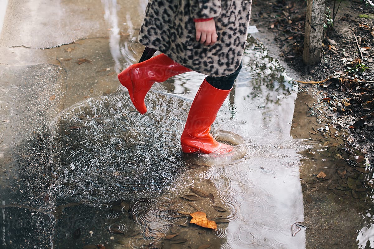 Woman standing in the puddle