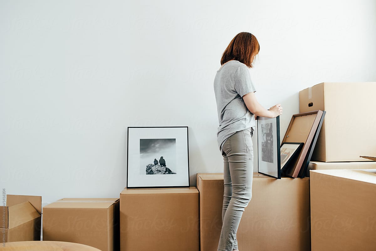 Young woman moving boxes