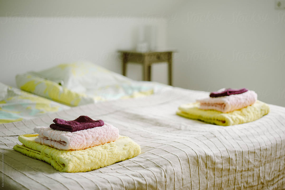 Folded Towels on Guest Bed