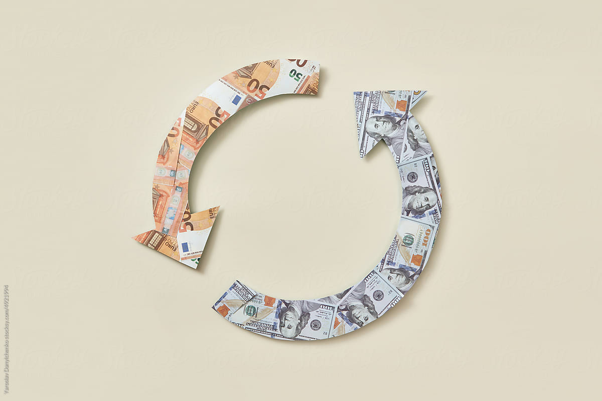 Recycle symbol made of dollar and euro bills.