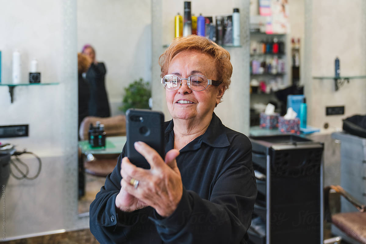 Senior Woman Taking a Photo at the Beauty Salon