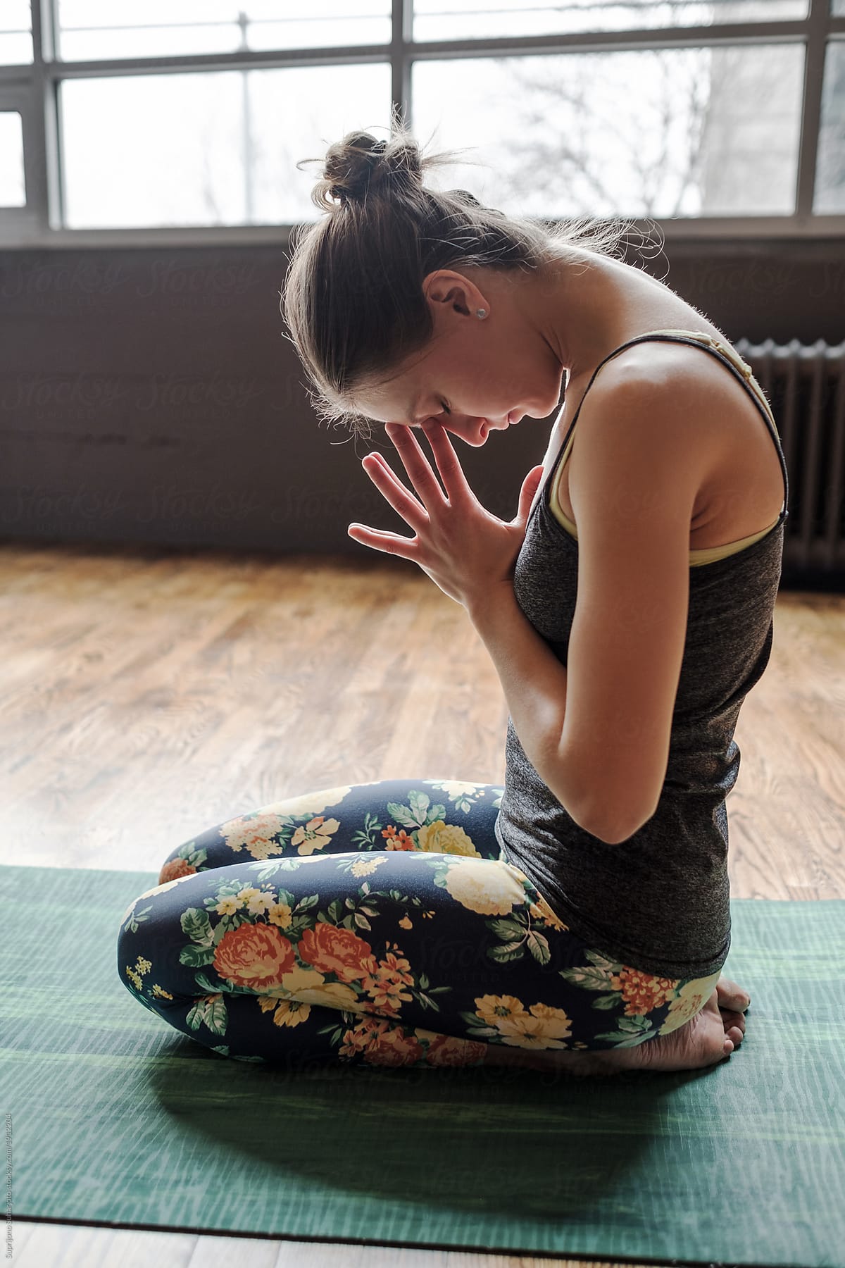 Beautiful Woman Practicing Yoga in a Studio