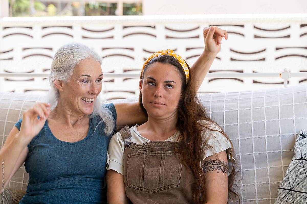 Funny portrait of mother and daughter at home