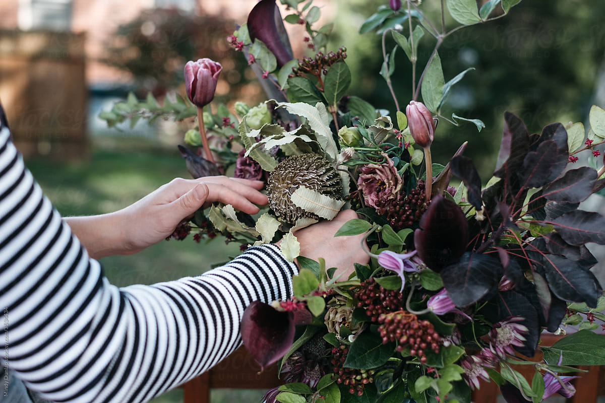 A florist assembles an arrangement