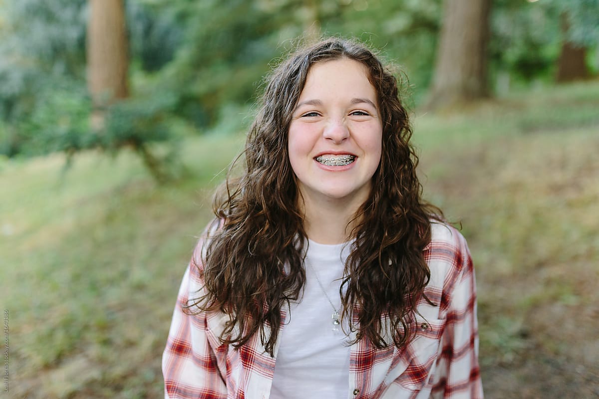 Smiling Pre Teen Wearing Braces On Teeth Del Colaborador De Stocksy