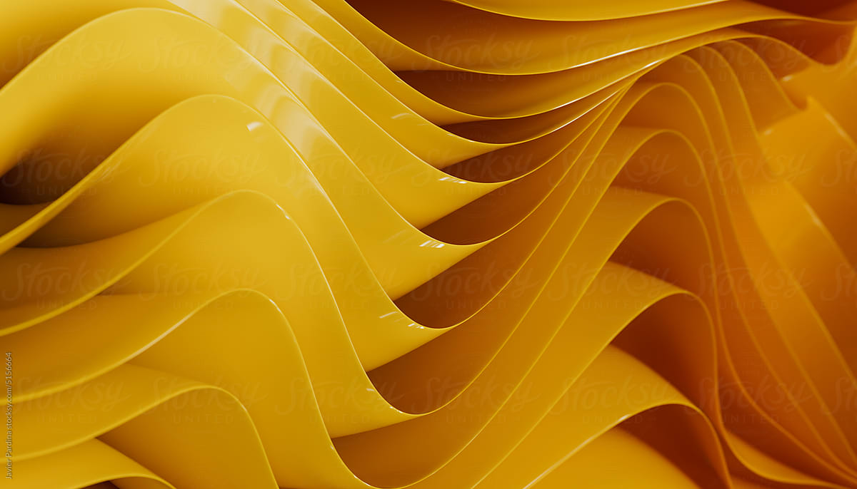 Abstract yellow background with layers of silk folded drapery