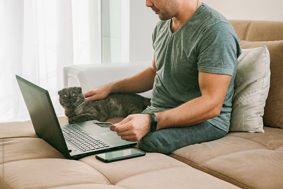 A disabled man does online shopping for his kitten
