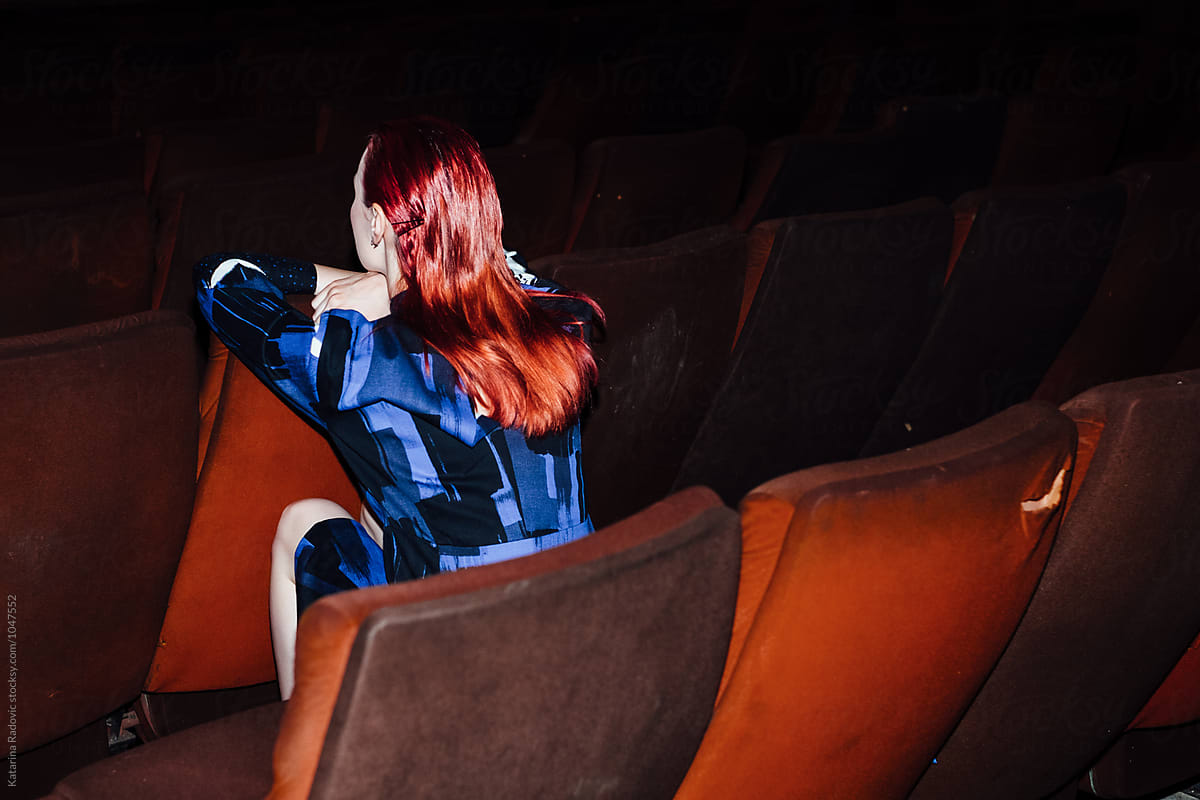 Fashion Model Sitting in the Cinema