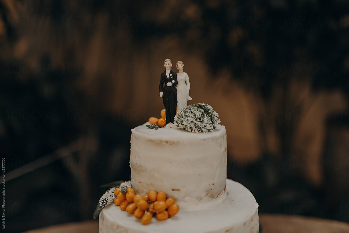A cake topper with a vintage bride and groom