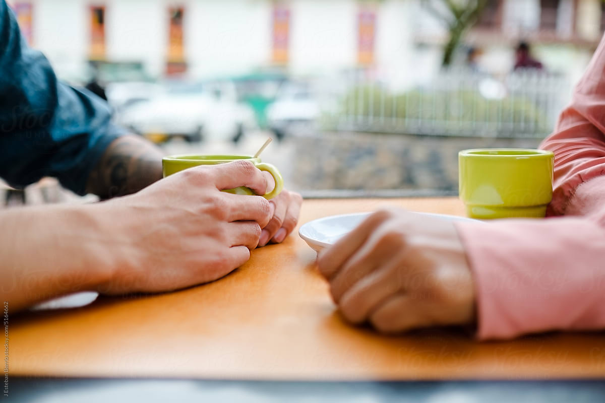 Close-up of a couple sharing a coffee