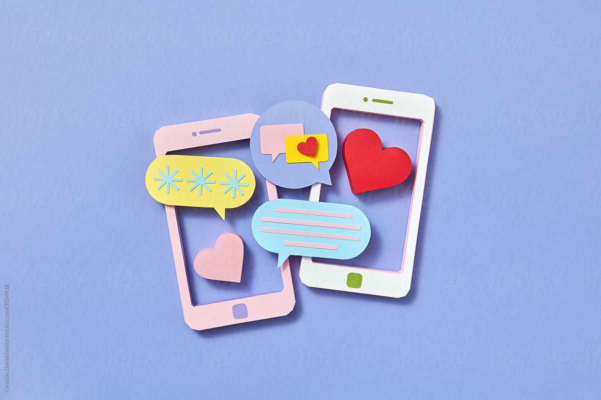 Two papercraft smartphones and chats cloud icons.