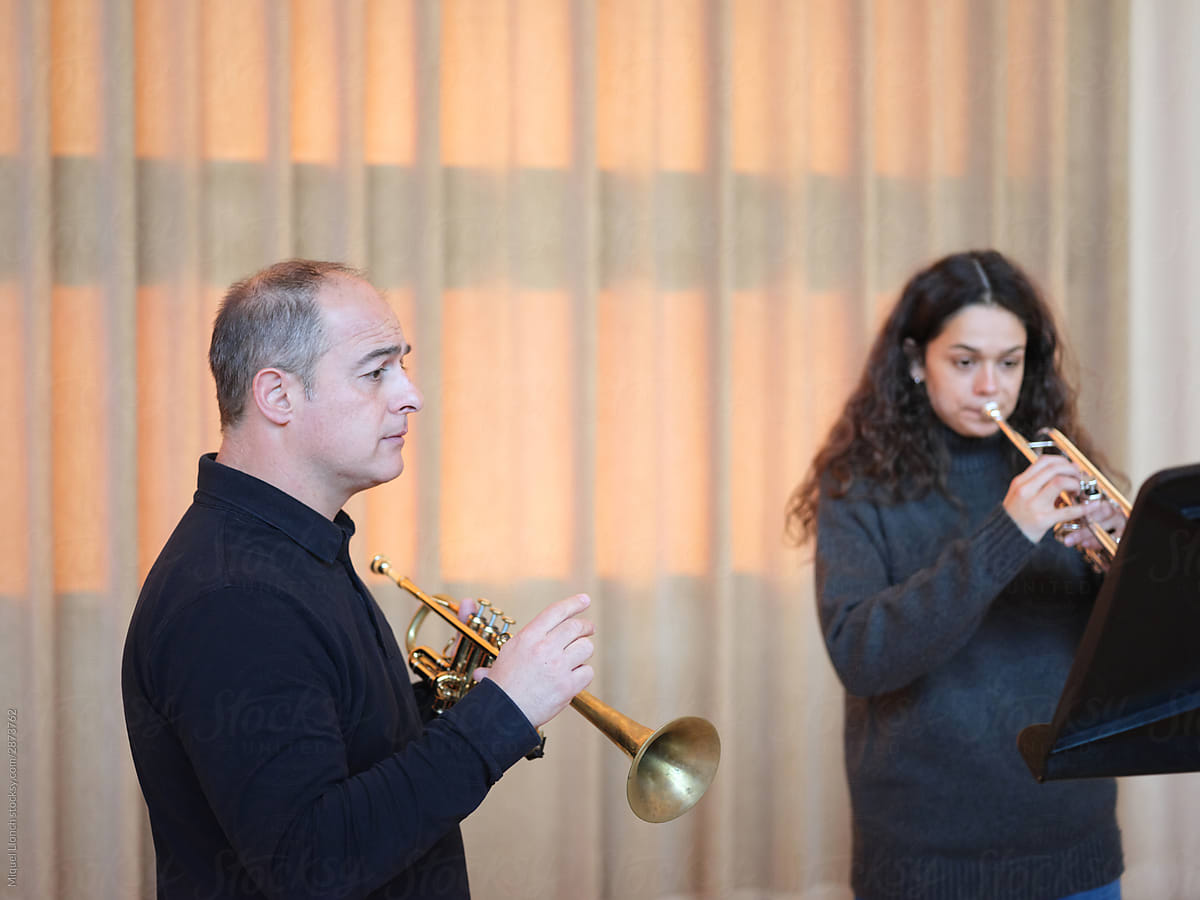 Trumpet teacher listening carefully the student performance