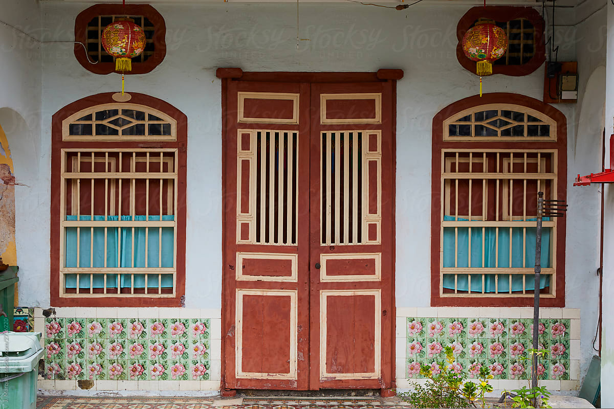 Colourful exotic house facade with door and shutters