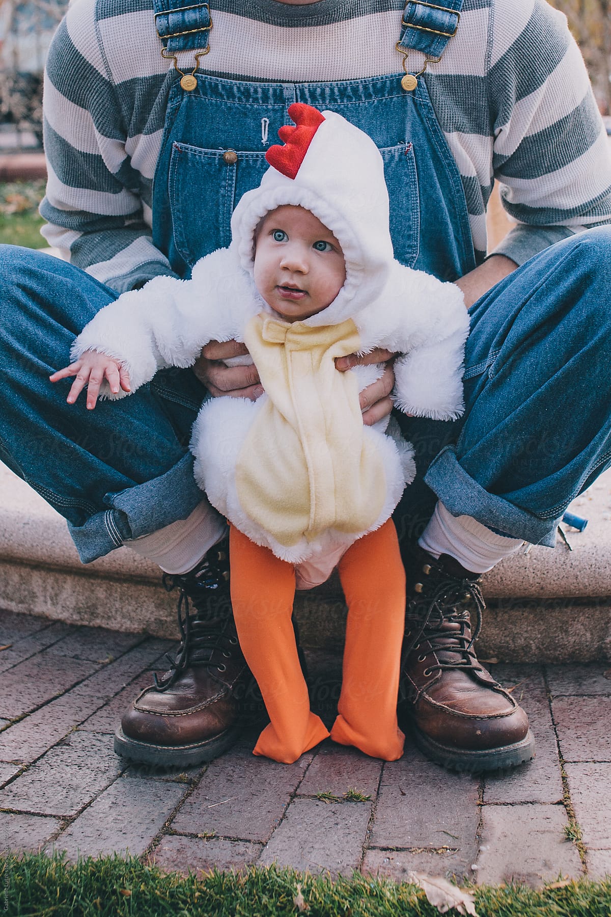 Dad Holding Baby in Chicken Costume