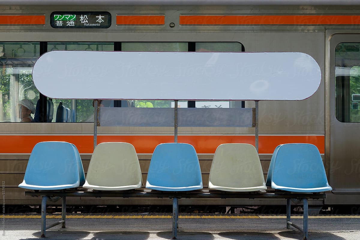 Row of blue seats on japanese train station