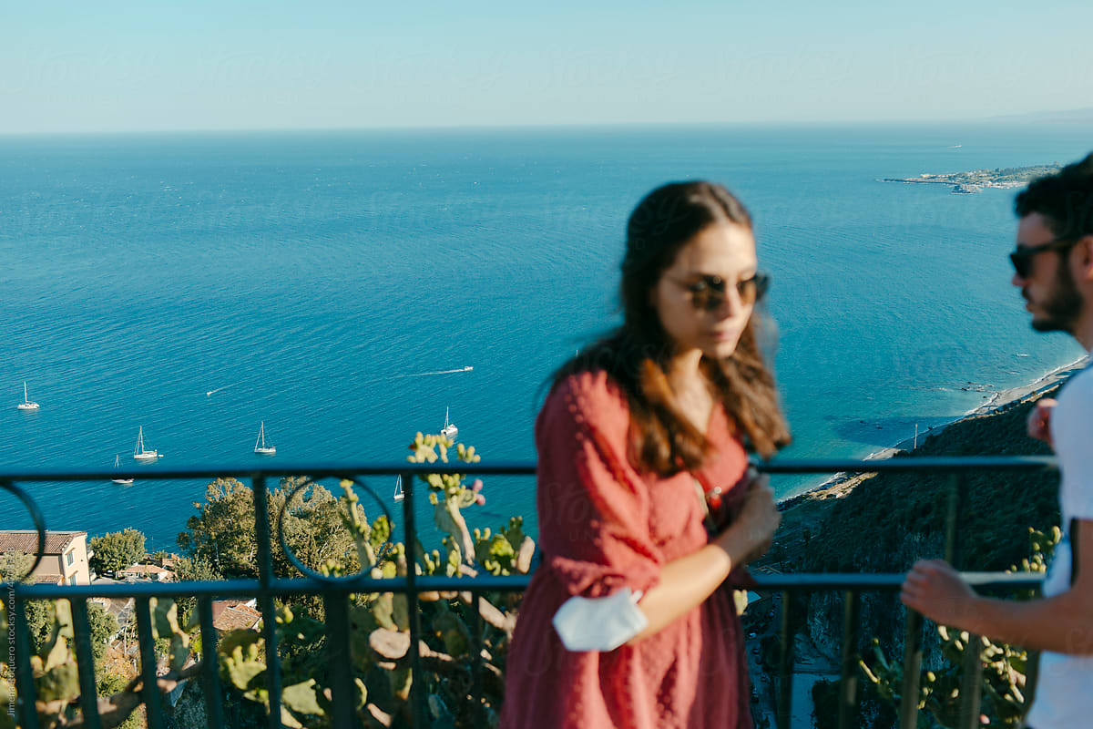 Tourist in front of panoramic view of the sea