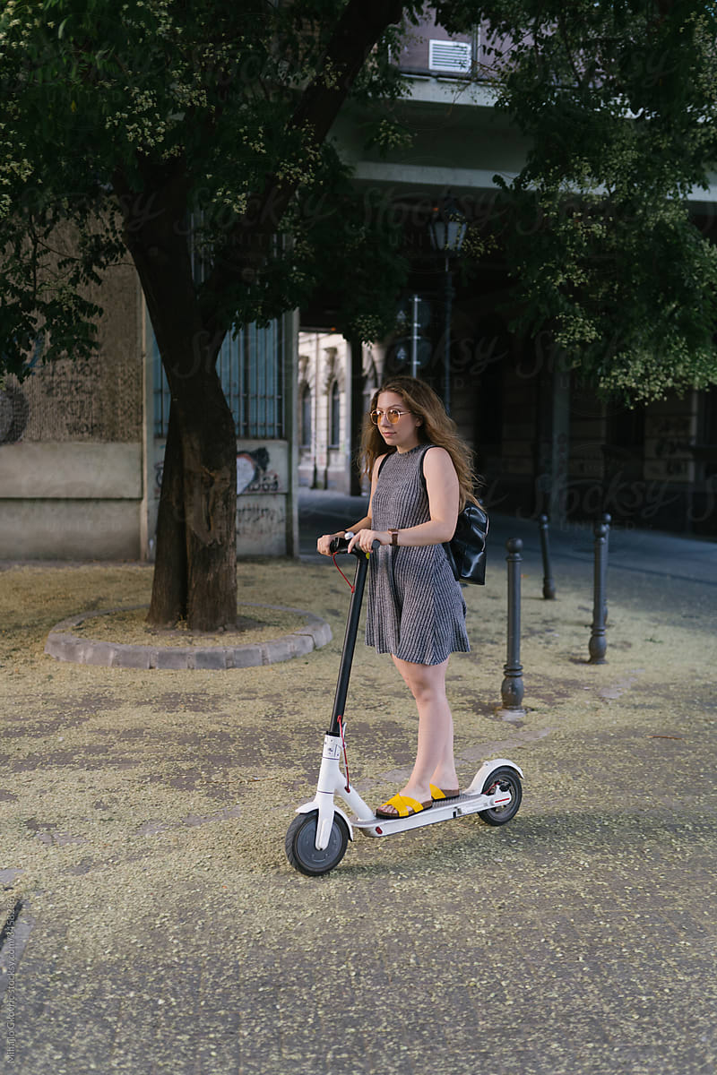 Girl driving electric scooter