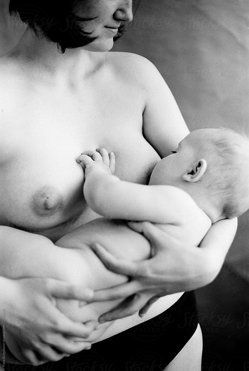 Naked Woman Breastfeeding Her Baby
