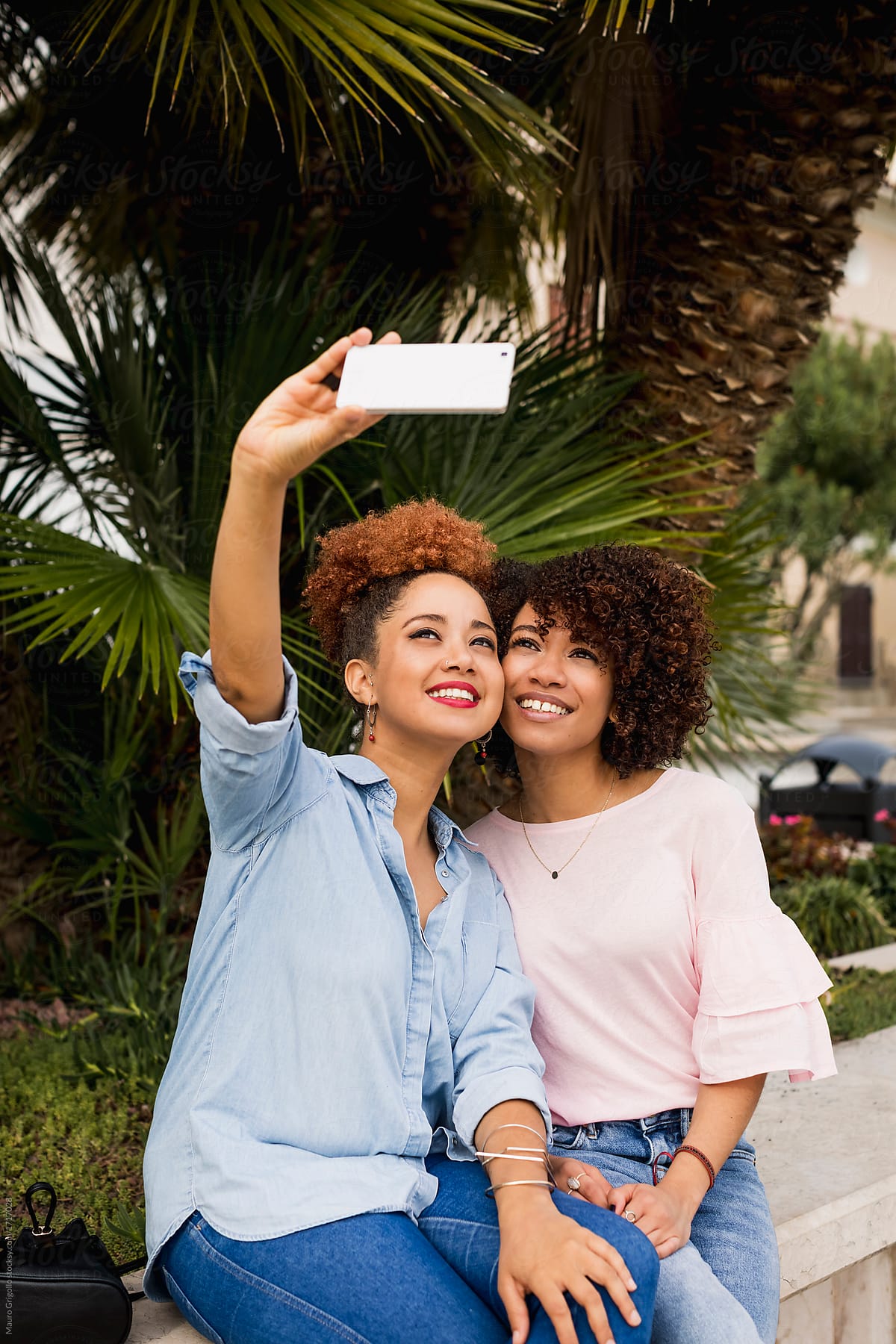 Women using a mobile phone for a selfie