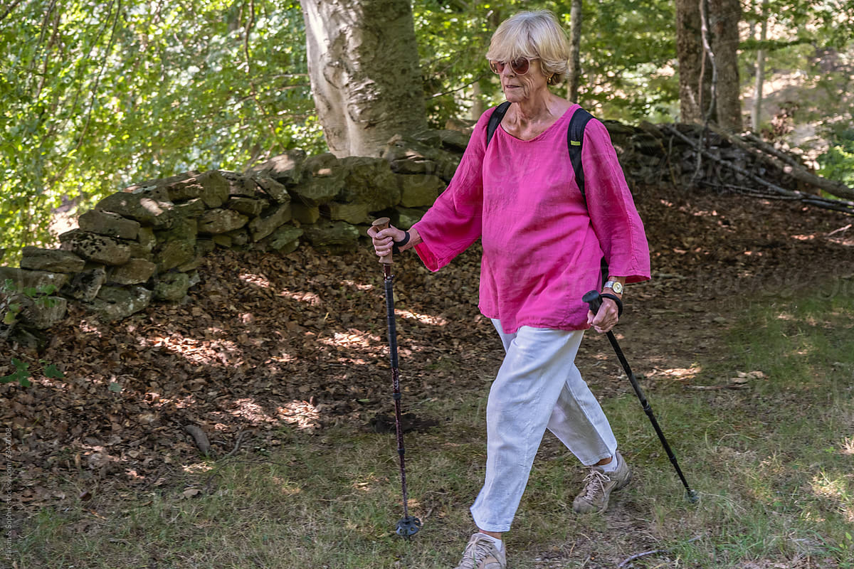 Vibrant elderly woman  walking  in nature