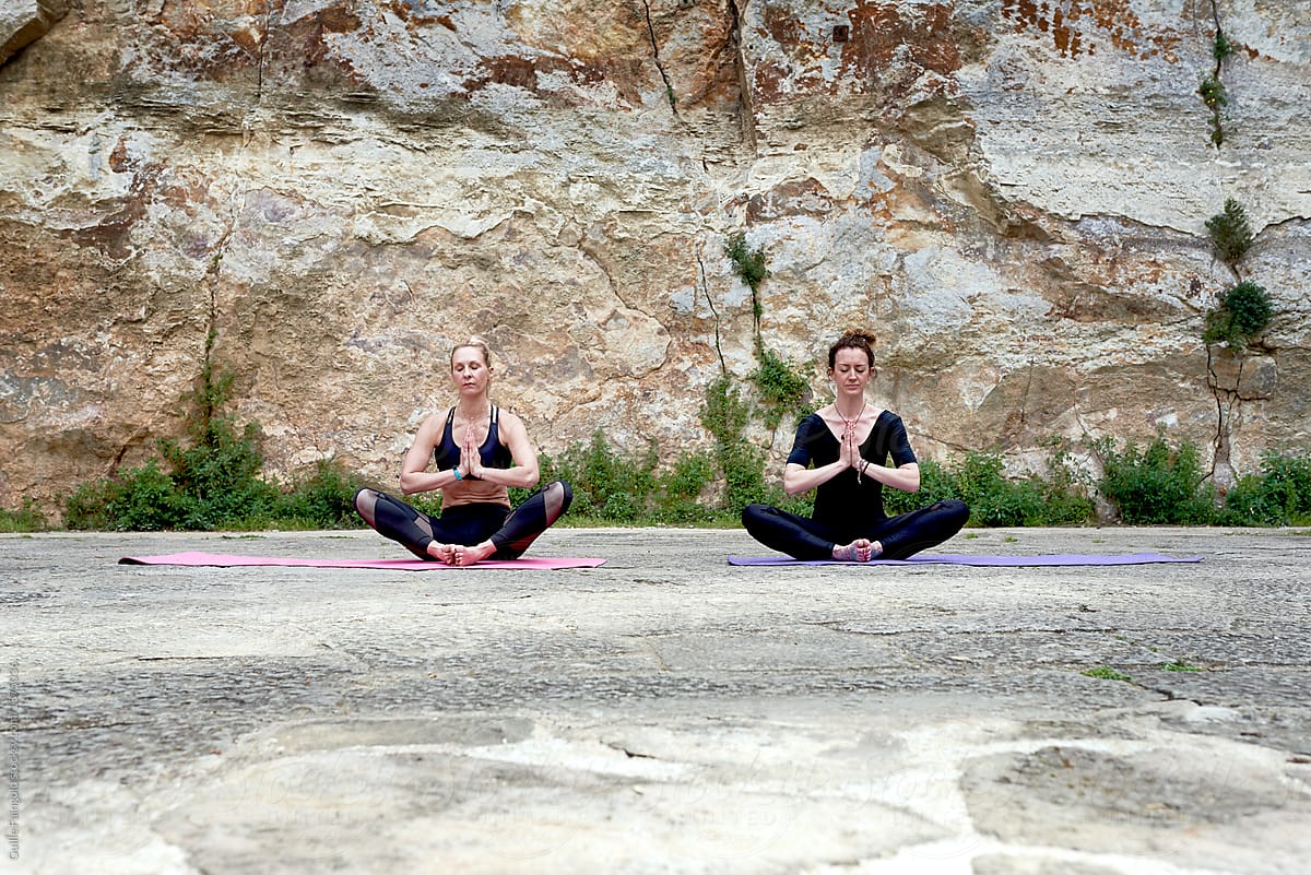Relaxed women sitting and meditating