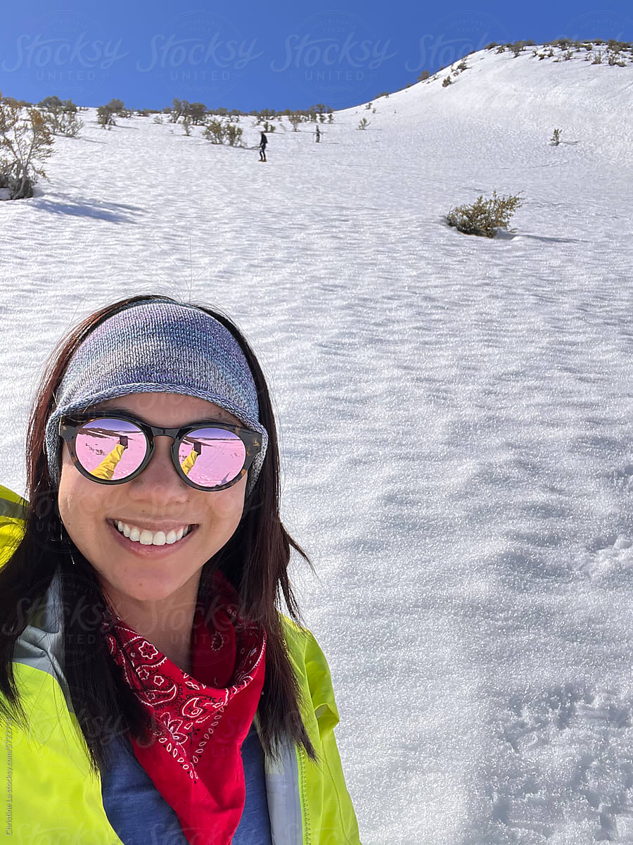 Real selfie of smiling outdoorsy woman on the snow