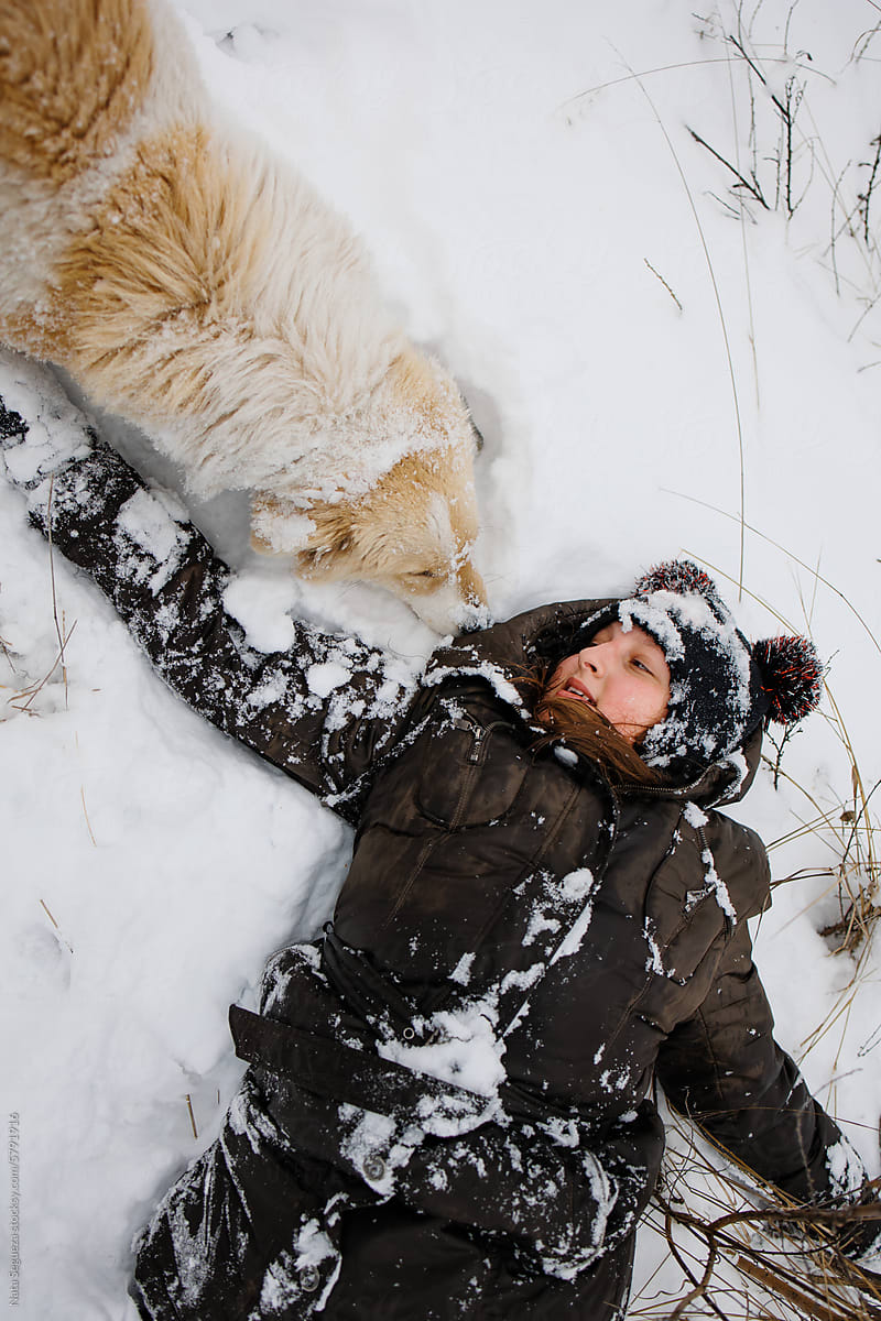 A girl with a dog in winter