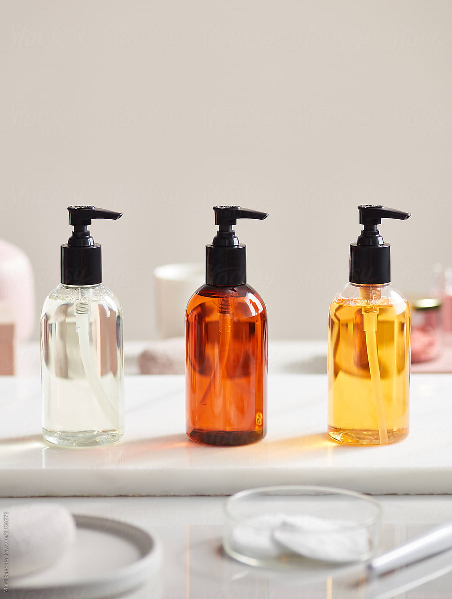 Beauty bottles with essential bodycare oils in row.