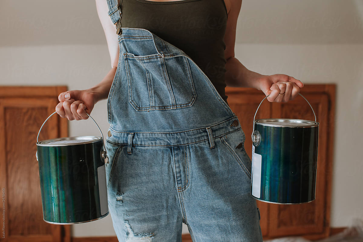 Strong Woman Carrying Paint Cans