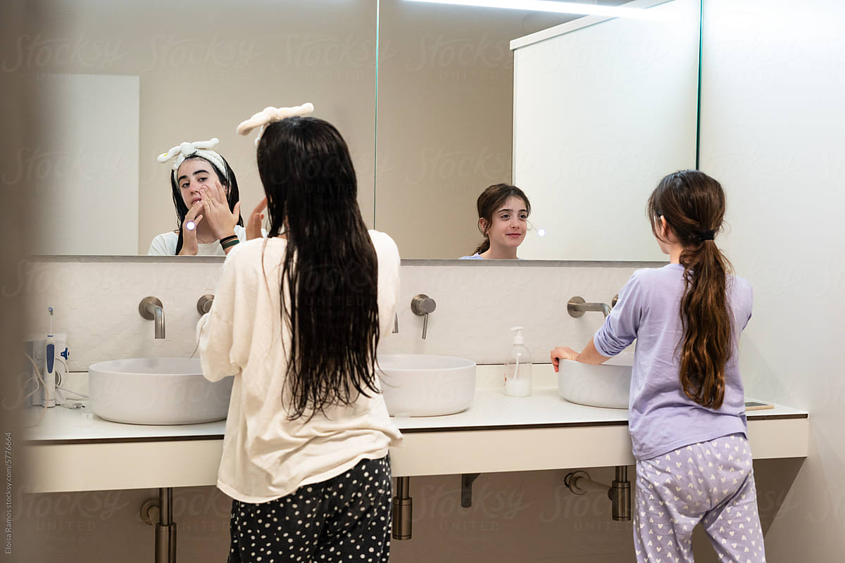 sisters kids girls brushing teeth before bedtime