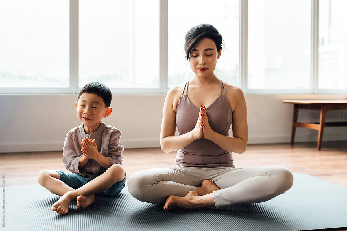 Mother And Son Practicing Yoga At Home By Stocksy Contributor Maahoo Stocksy