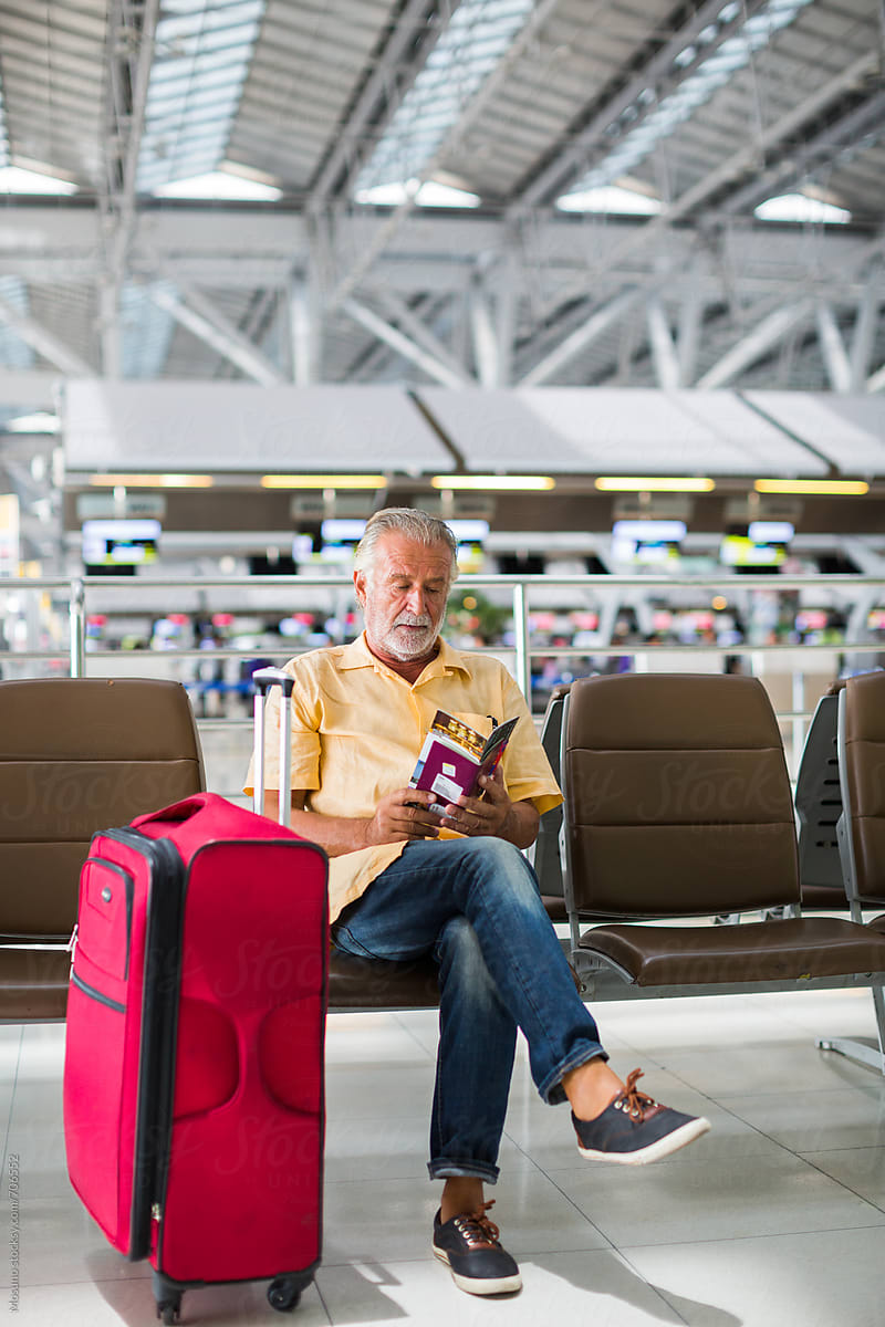 Senior Man Sitting at the Airport Gate