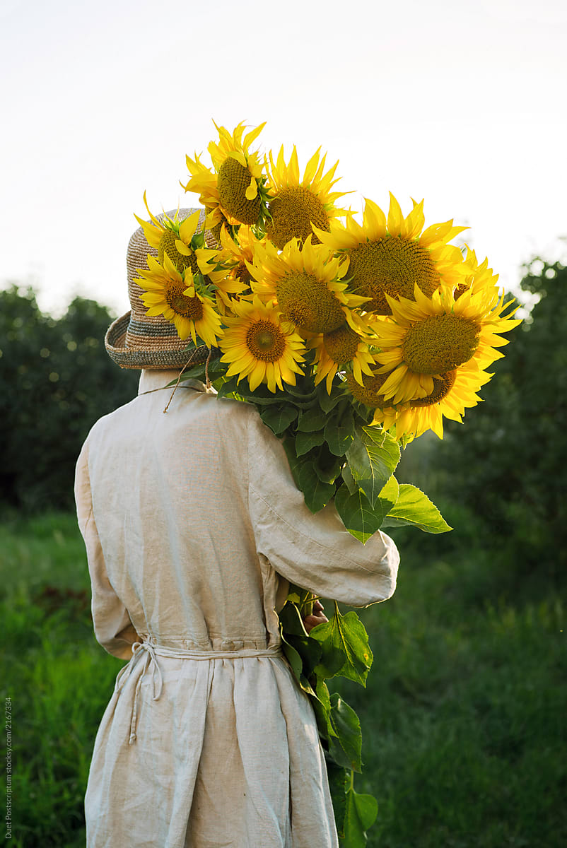 Girl Holding A Large Bouquet Of Sunflowers By Stocksy Contributor Duet Postscriptum Stocksy 