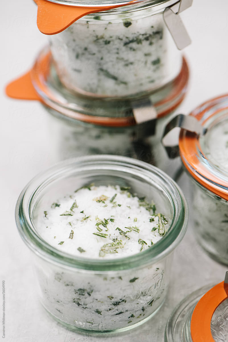 Canning jars filled with rosemary-infused salt