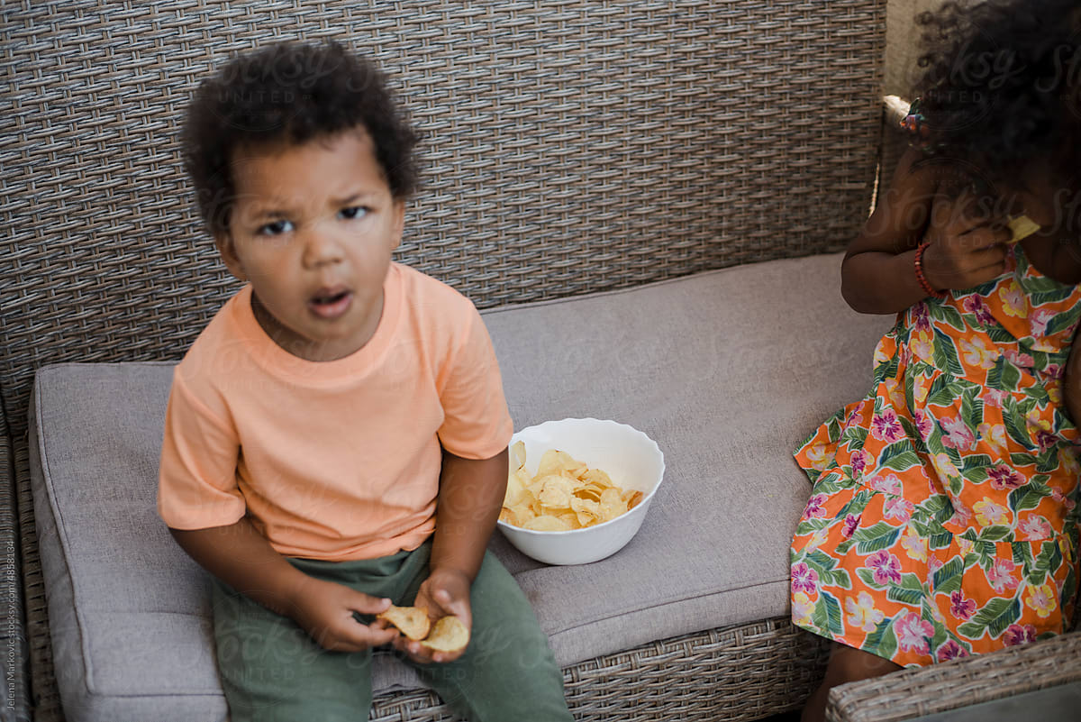 Toddlers eating chips