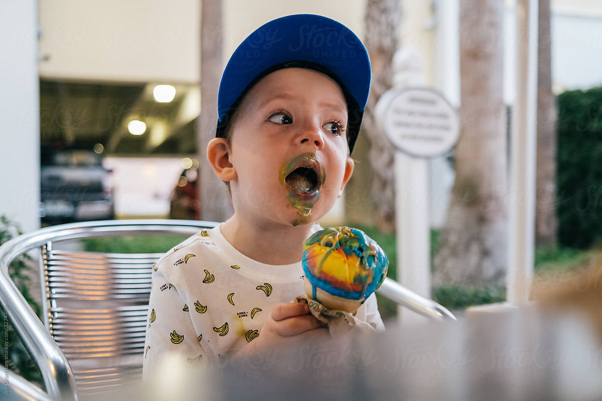 Toddler boy eating ice cream
