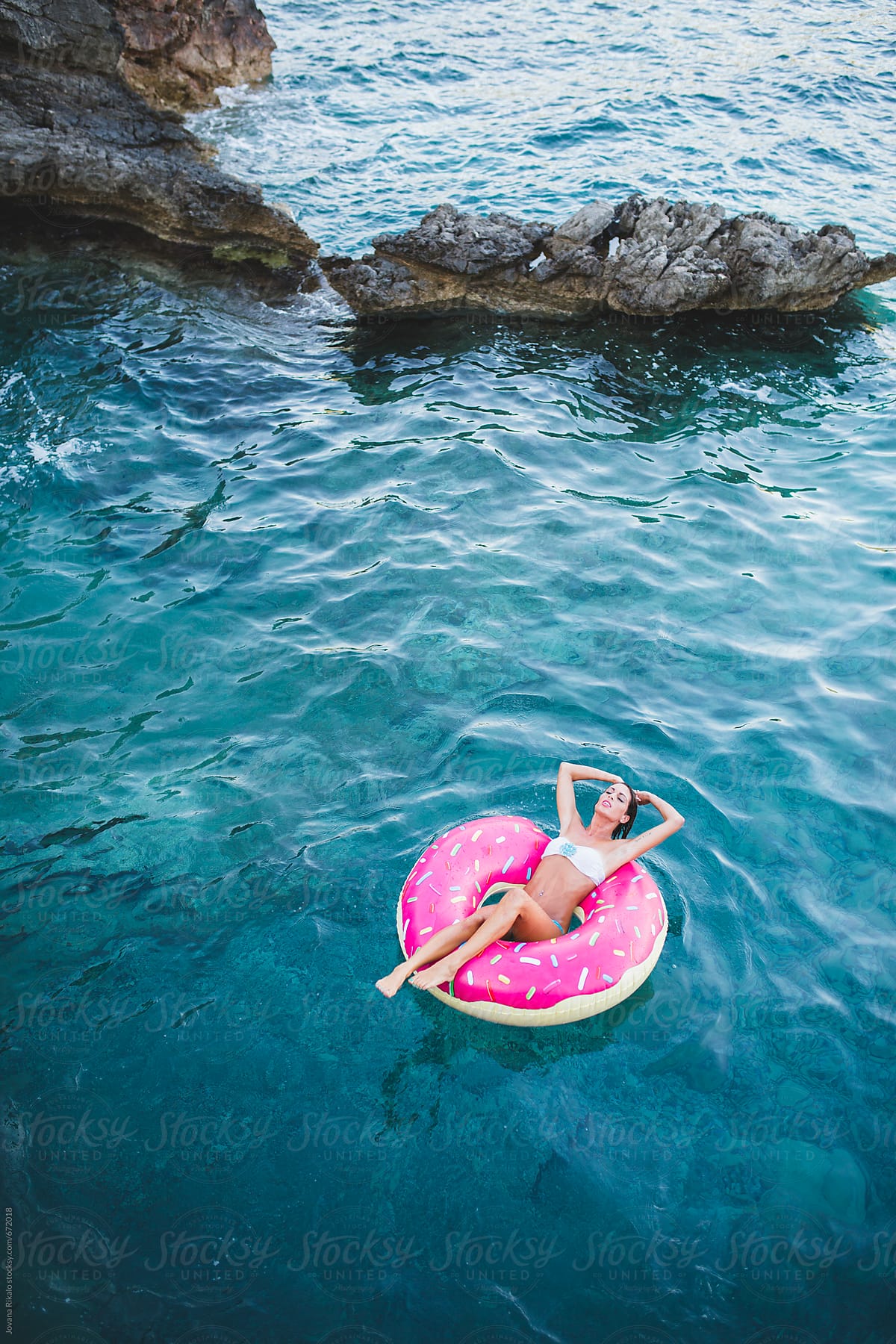 Woman floating on inflatable tube  in the sea
