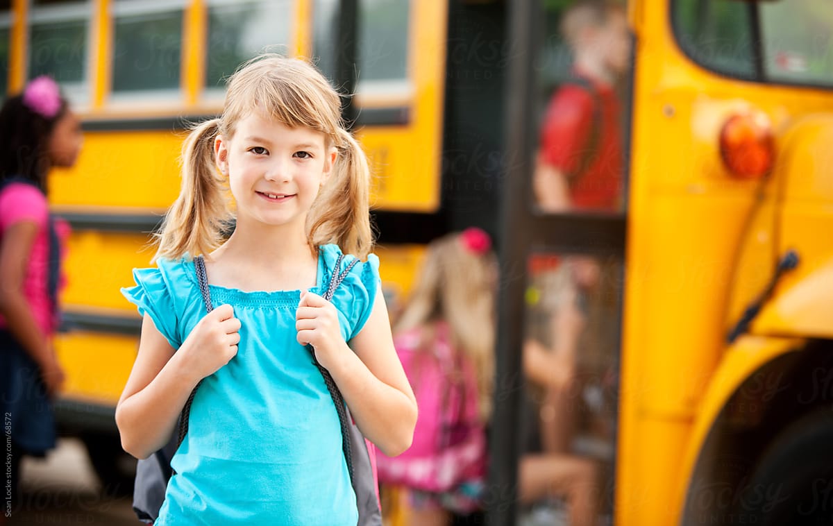School Bus: Young Girl with Backpack