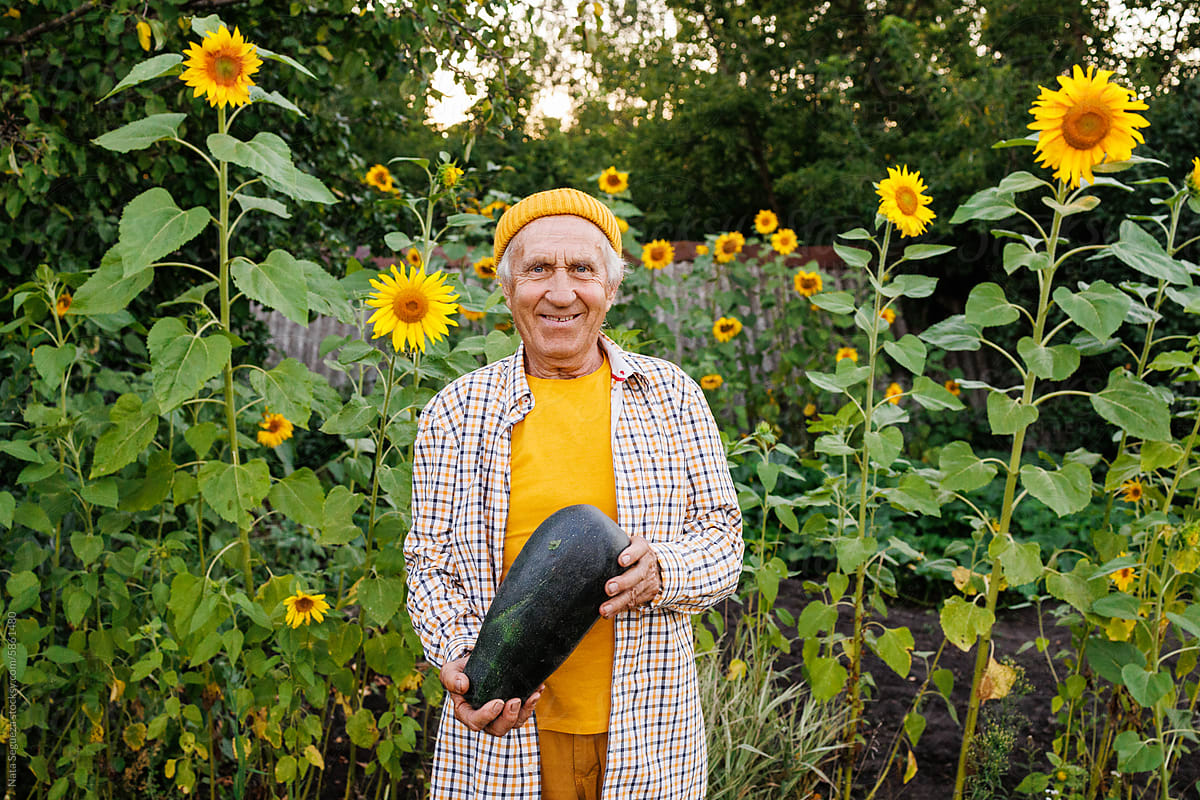 A man with a zucchini