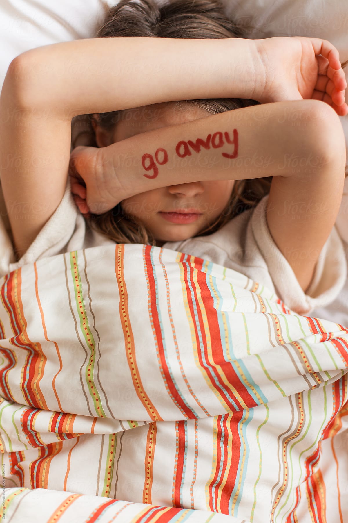 Grumpy Tween Girl Laying In Bed With The Words By Stocksy Contributor Amanda Worrall Stocksy 8707