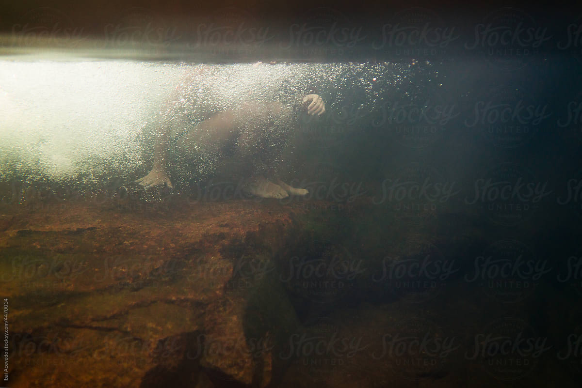 Underwater portrait of a woman inside wild pool