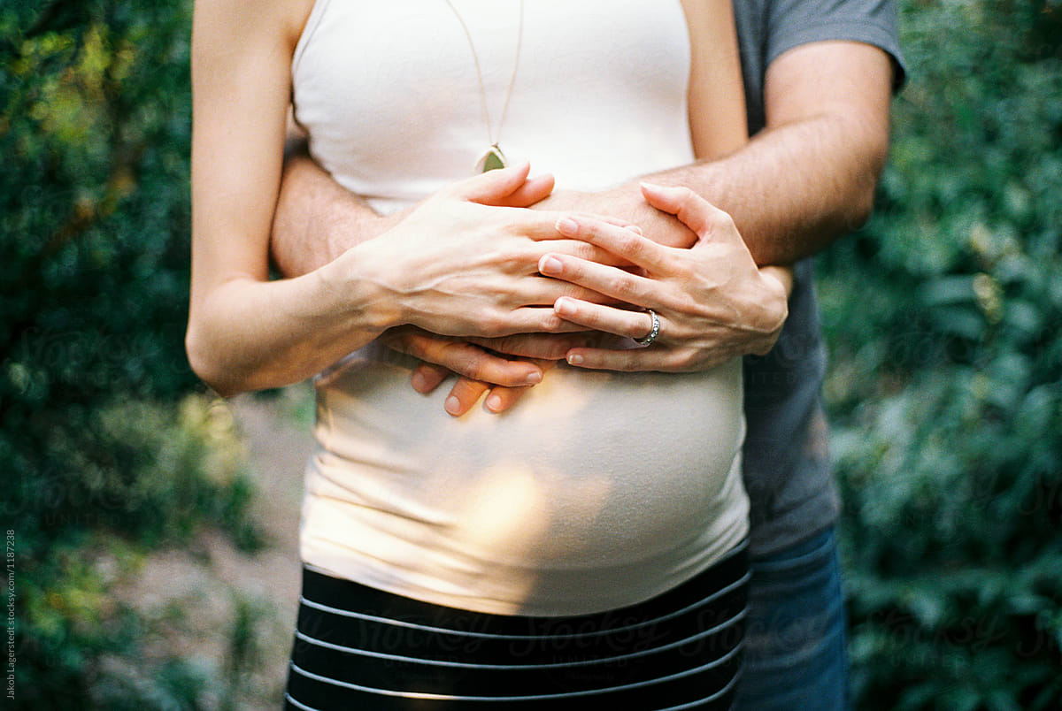 Couple Holding A Pregnant Belly By Stocksy Contributor Jakob Lagerstedt Stocksy 