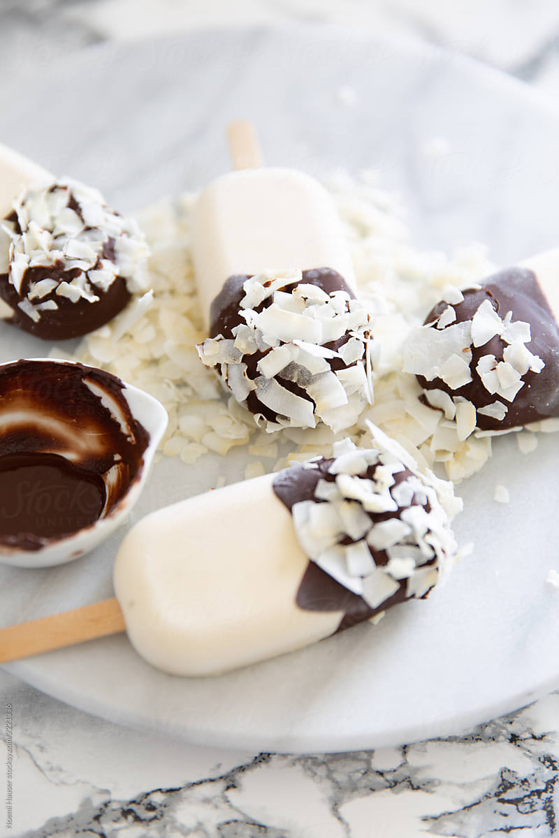 Coconut ice cream coated with chocolate and coconut flakes