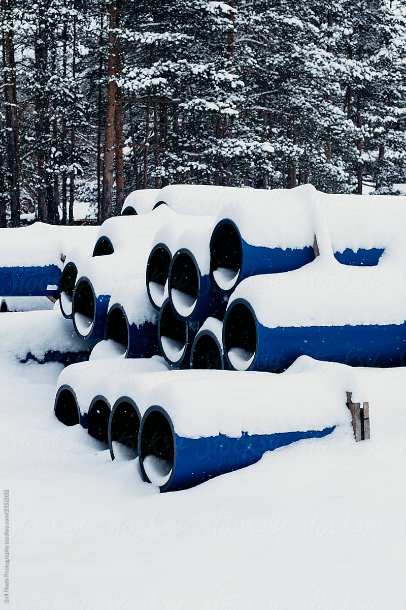 Blue pipes in the forest covered