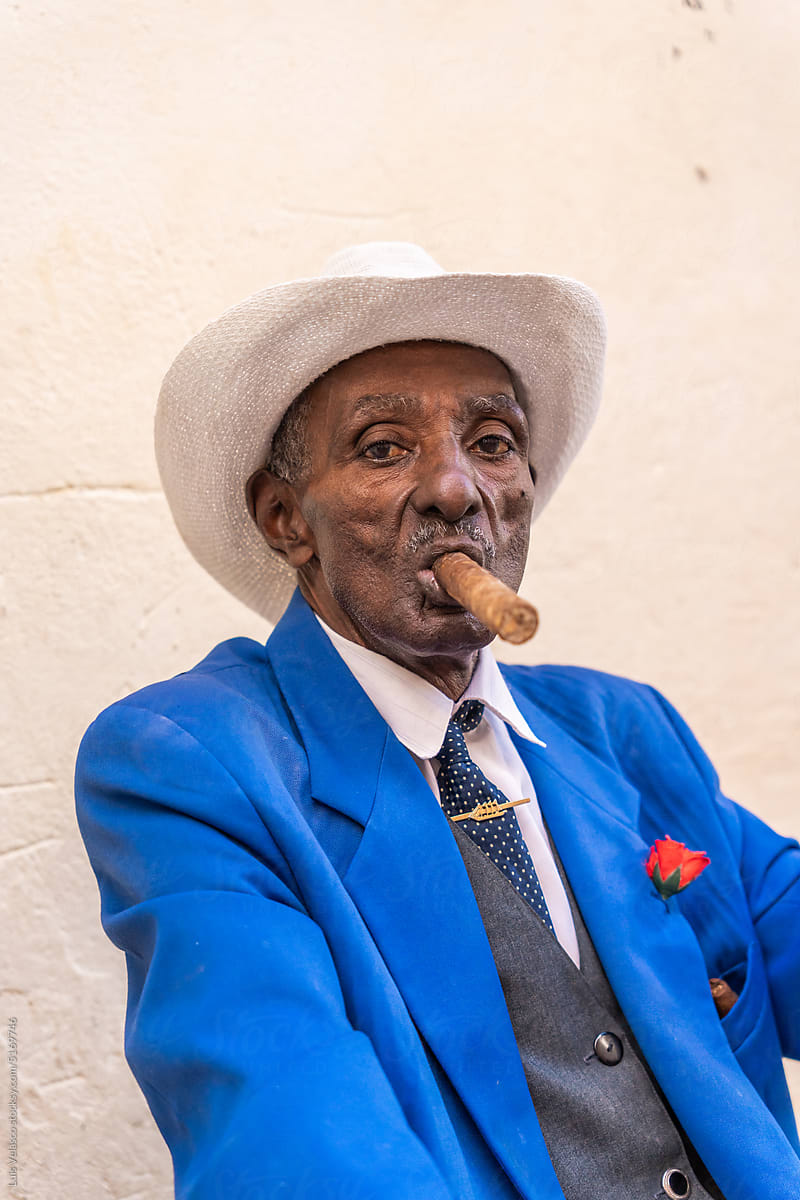 Street Portrait Of Local Man Smoking Cigar In Havana