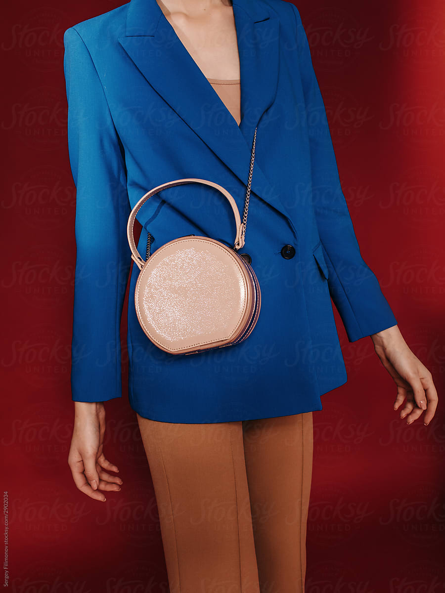 Stylish woman with round bag - Fashion details