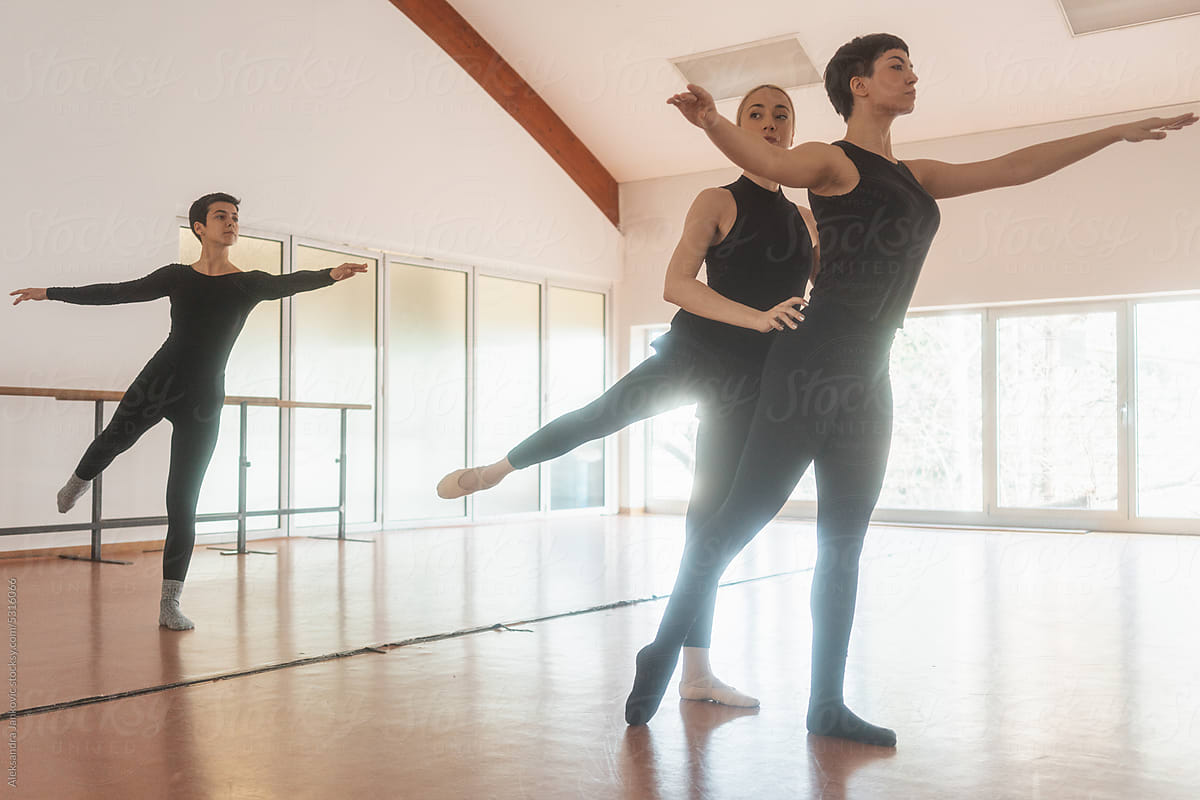 Women Practicing Ballet Routine With A Teacher